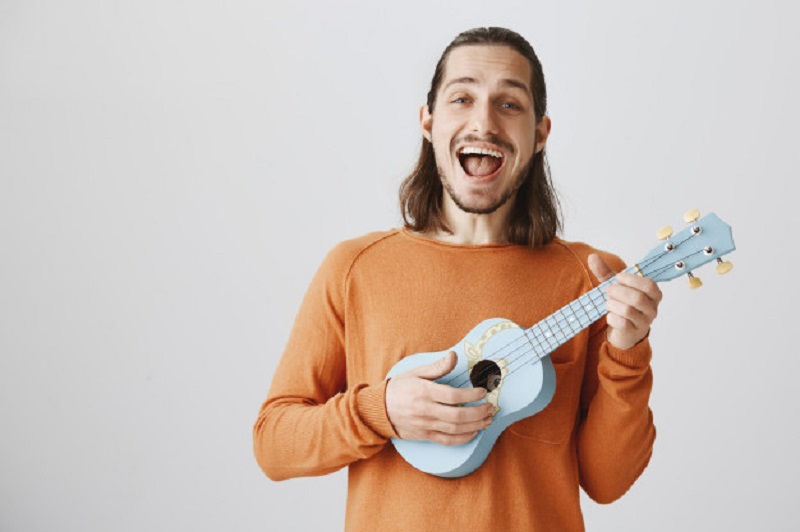 happy man with ukulele