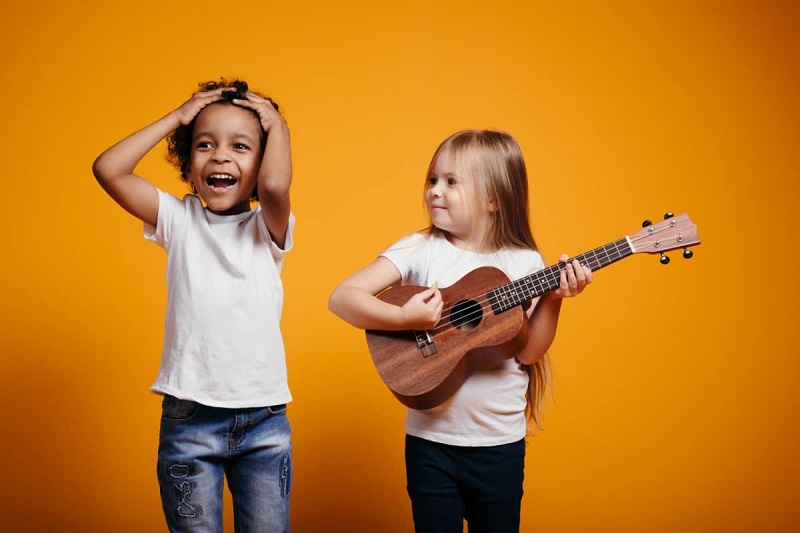 Kids having fun with ukulele