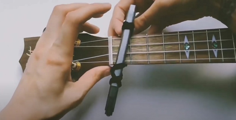 Diy capo for ukulele adding on the fretboard step 4