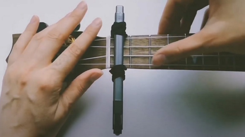 Diy capo for ukulele adding on the fretboard step 5