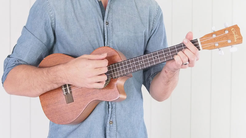 holding ukulele