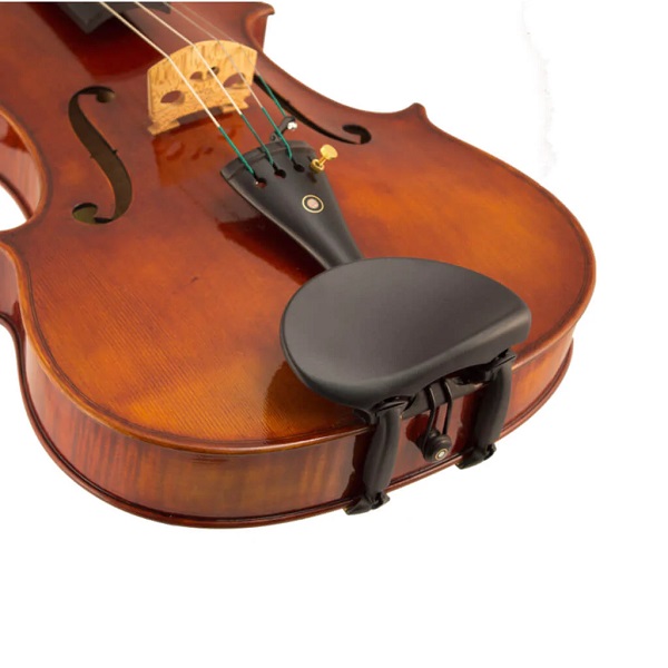 violin lying on the floor with a chin rest