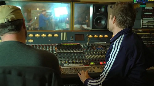 two producers working in a studio