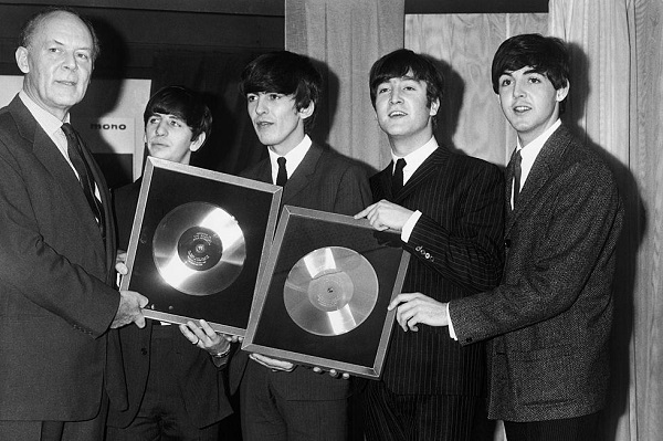 Beatles receiving an award