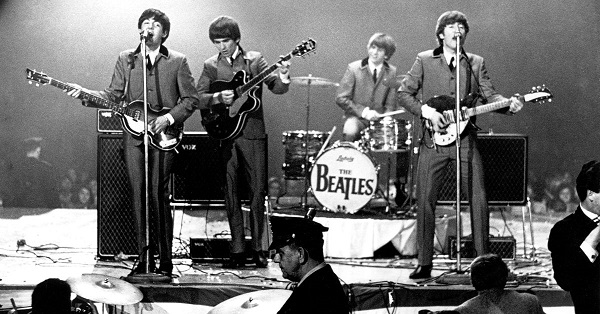 the Beatles performing on the stage