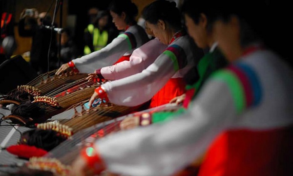 Chinese people playing harp