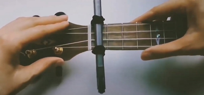 Diy capo for ukulele adding on the fretboard step 3