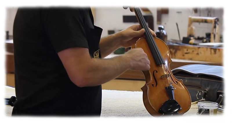 polishing the violin