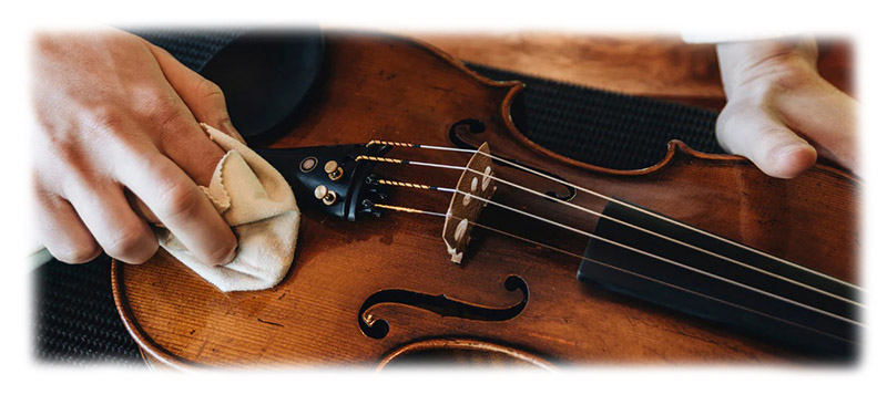 wiping the body of the violin instrument