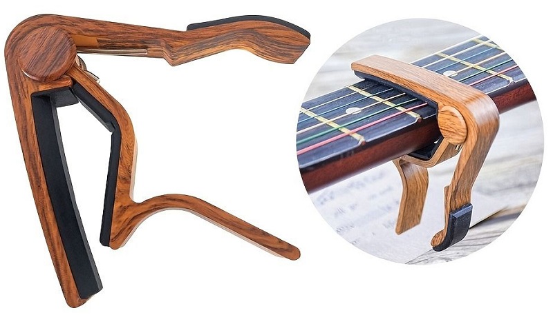 ukulele capos on fretboard